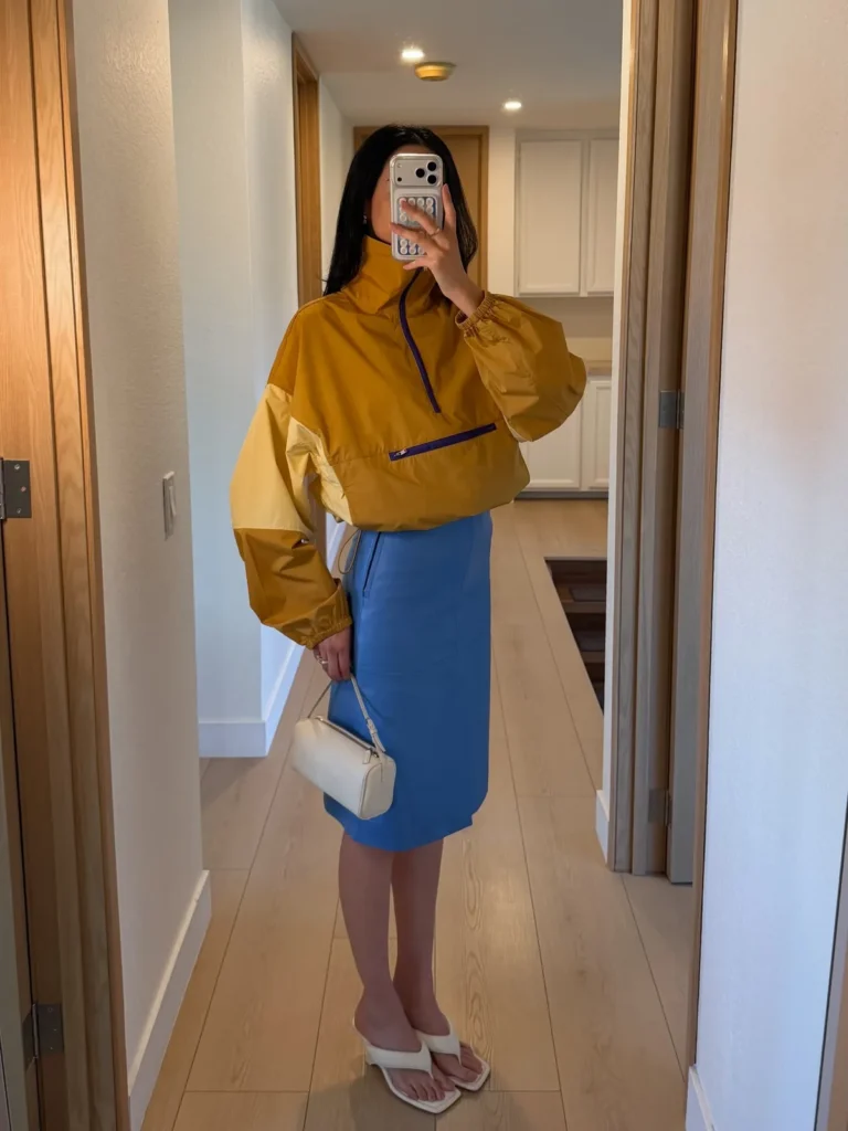 A Mustard Windbreaker With a Blue Leather Pencil Skirt