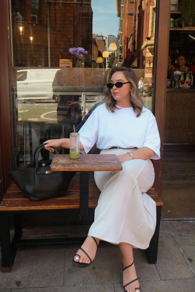 Midsize Business Casual in a White Tee and Cream Trousers