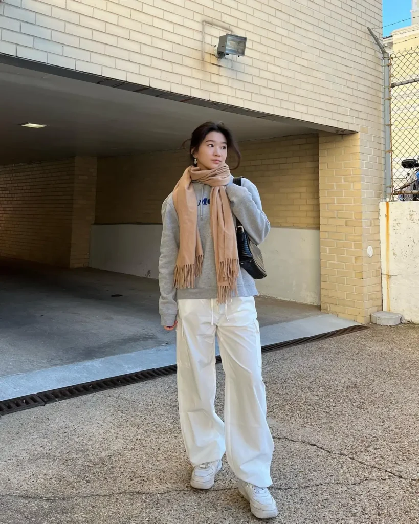 A Gray Hoodie, a Camel Scarf, and White Cargo Trousers