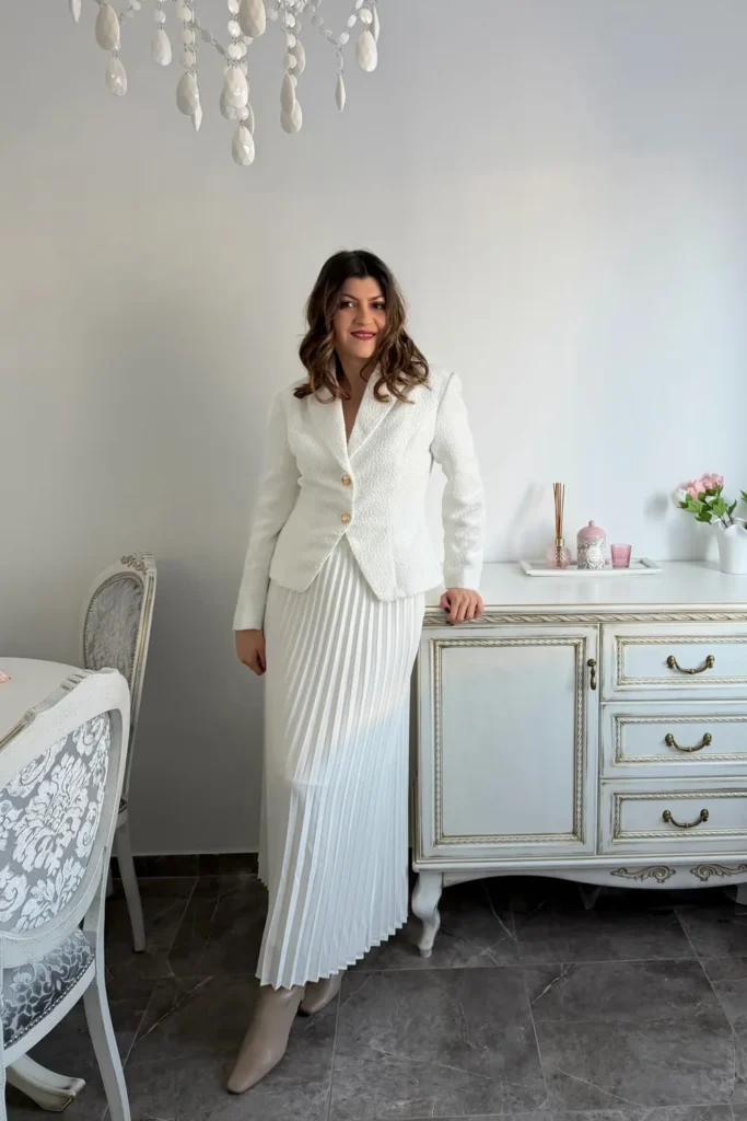 White Tweed Blazer With a White Pleated Maxi Skirt