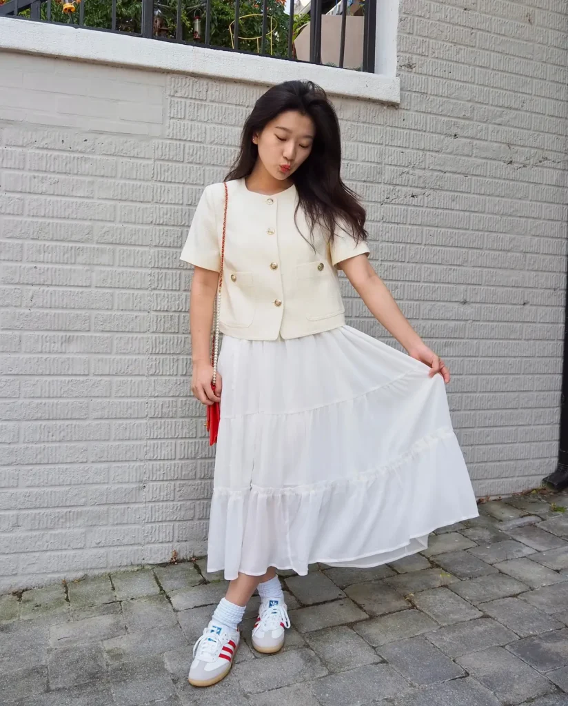 A Cream Tweed Jacket With a White Tiered Skirt