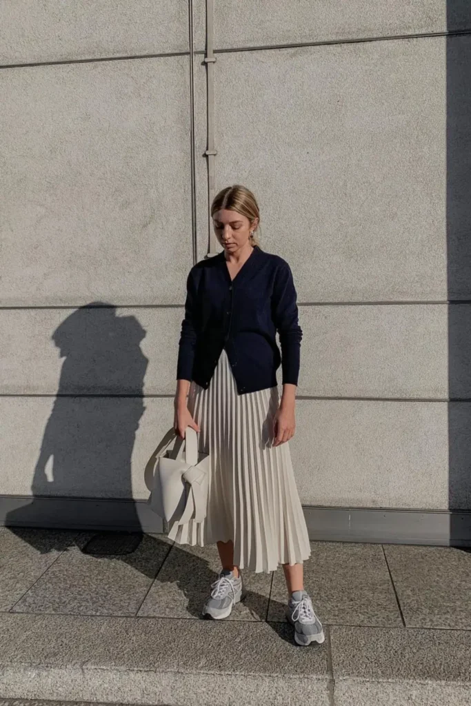 Navy Cardigan and a Cream Pleated Midi Skirt