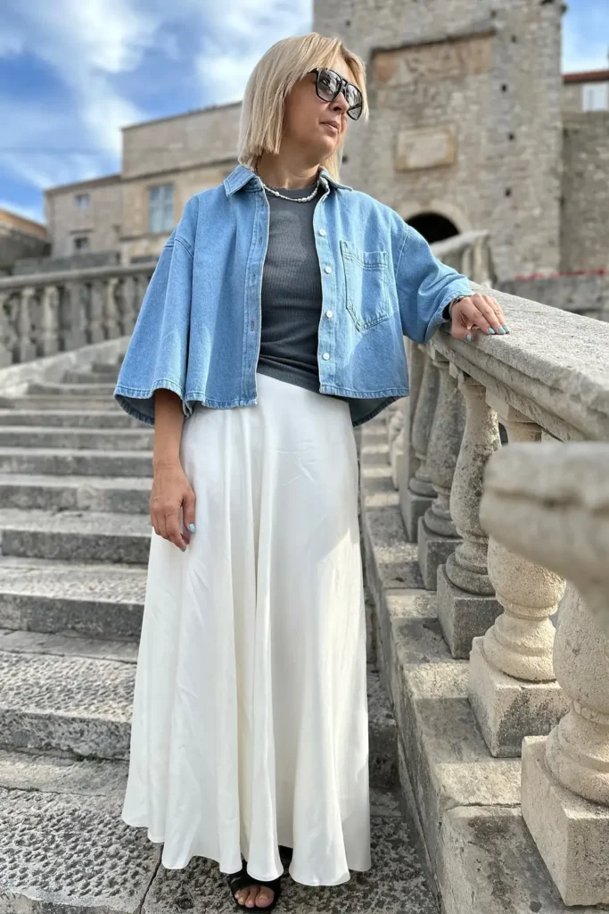 Cropped Denim Shirt With an Ivory Satin Maxi Skirt