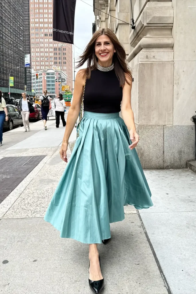 Teal Pleated Midi Skirt With a Black Mock Neck Top