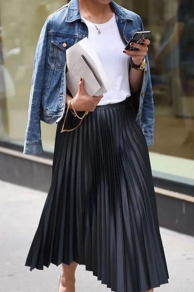 Black Pleated Midi Skirt With a White Tee and Denim Jacket