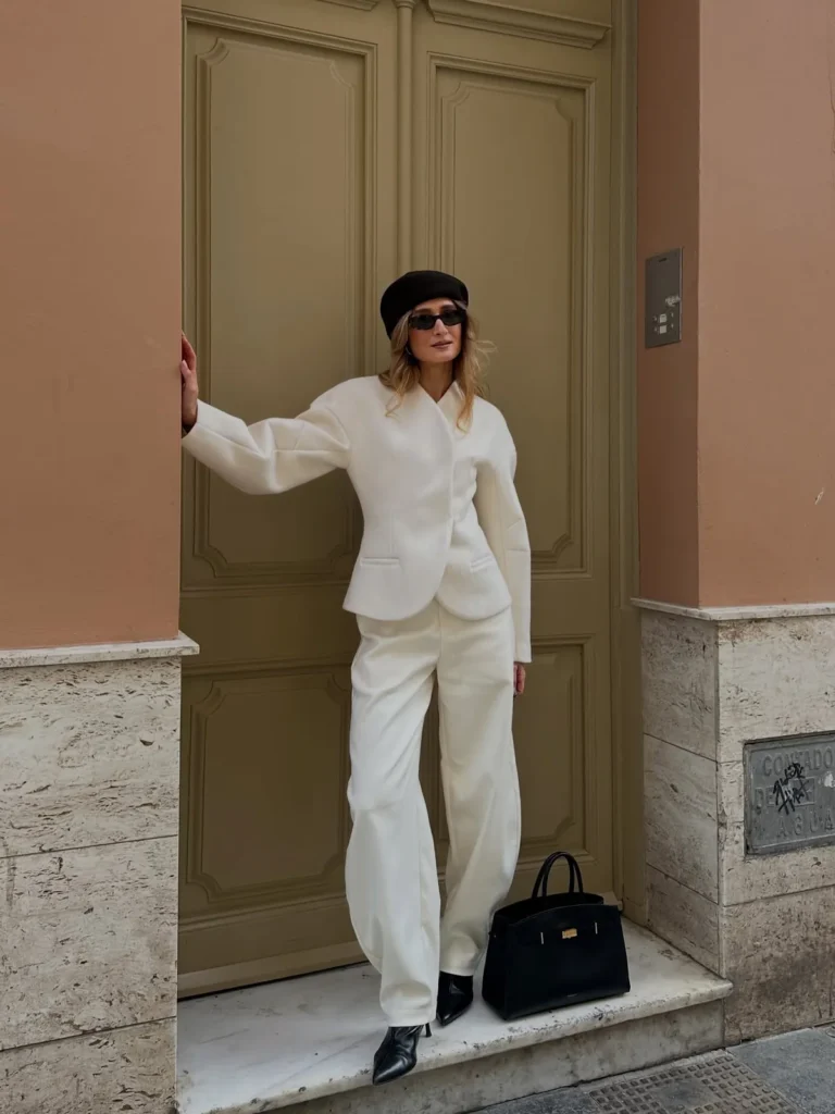 The Sculpted Ivory Jacket With a Brown Beret