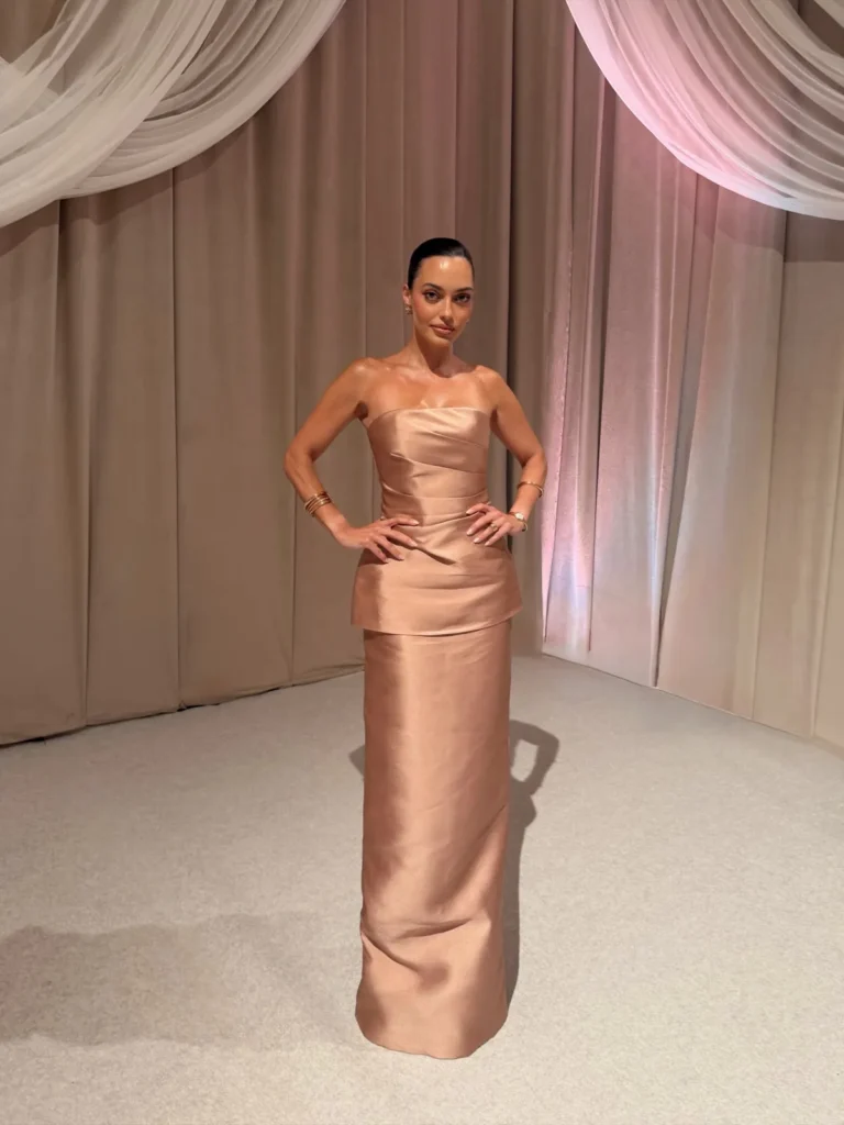 A Rose Gold Satin Column With a Peplum