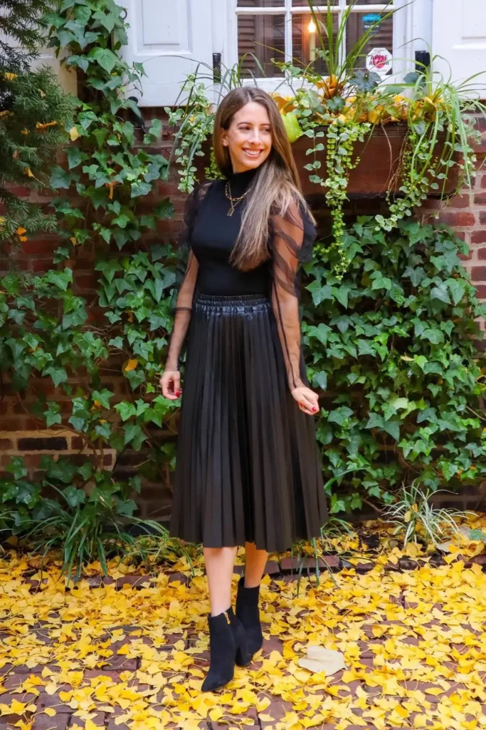 Black Faux Leather Pleated Skirt With Sheer Sleeves