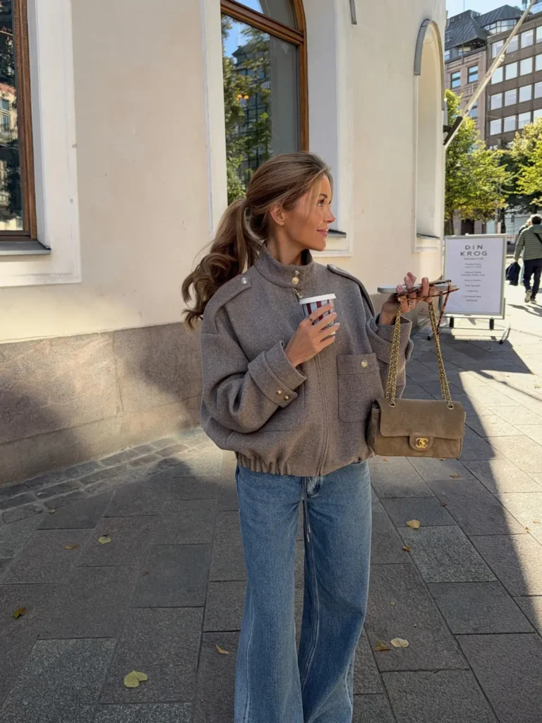 A Taupe Wool Bomber With Gold Buttons and Wide Leg Jeans