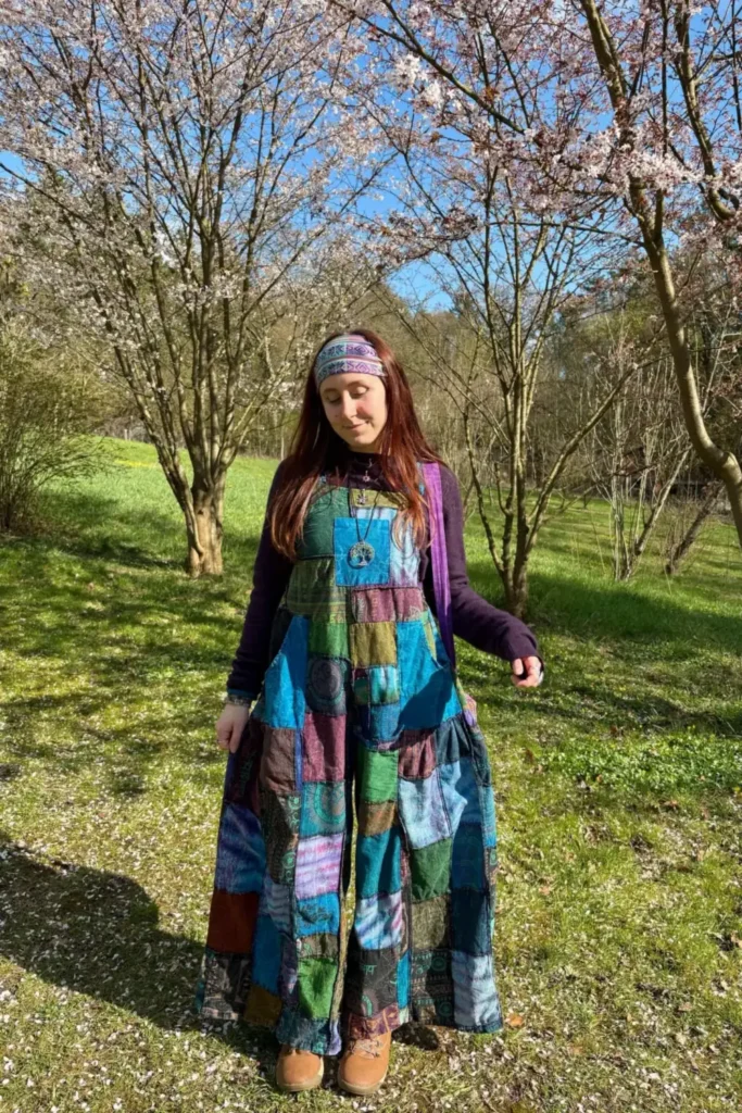 Blue Patchwork Overalls Over a Plum Knit