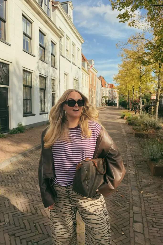 Striped Tee and Zebra Print Trousers With a Leather Jacket