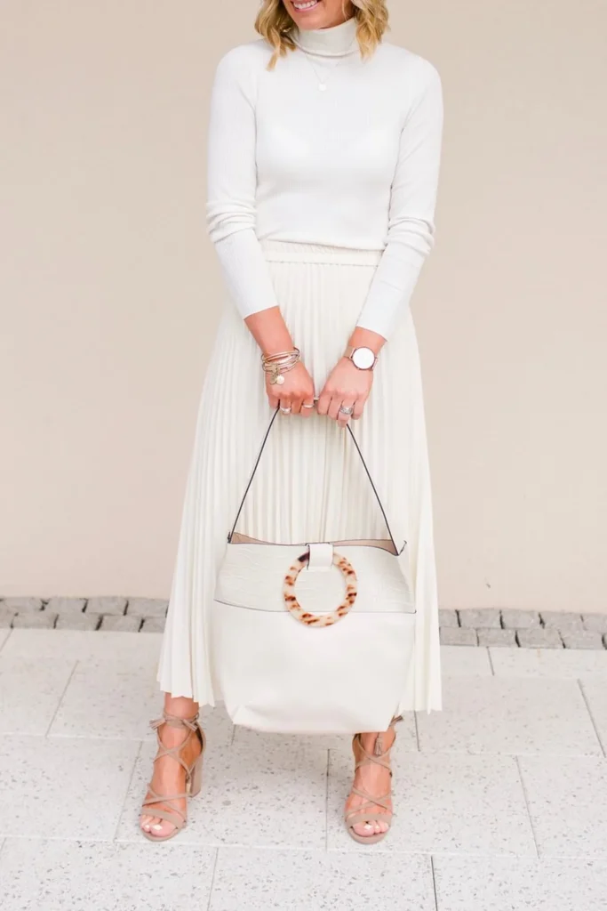 A Tonal Cream Turtleneck and Pleated Midi Skirt