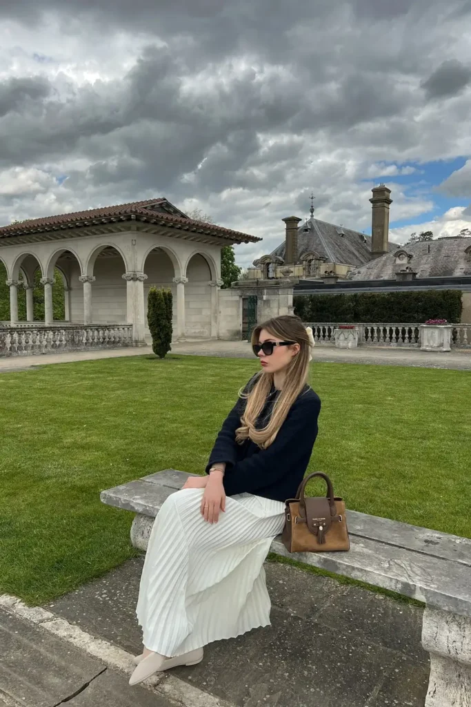 Navy Tweed Jacket With a White Pleated Maxi Skirt