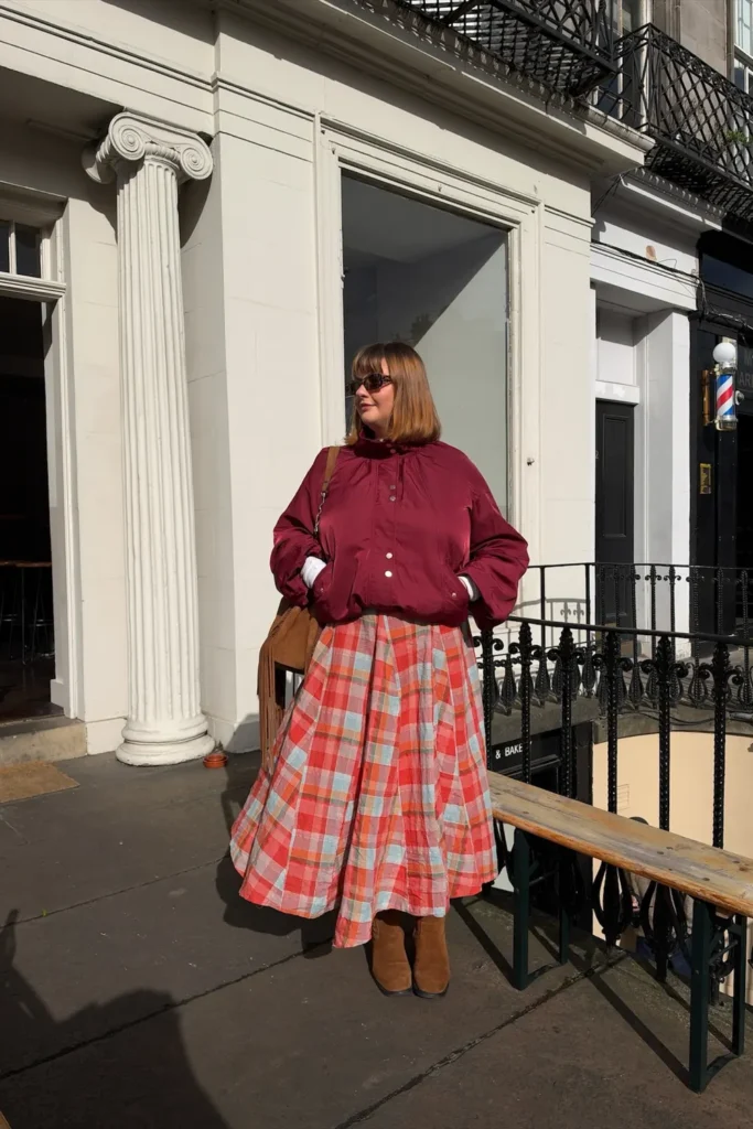 Burgundy Bomber Jacket With a Plaid Midi Skirt