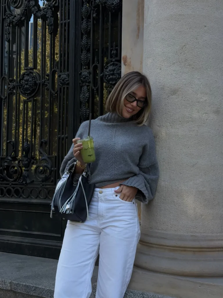 A Gray Turtleneck Sweater With White Jeans