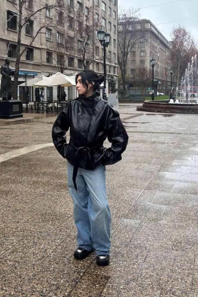 A Belted Black Leather Jacket With Baggy Denim and Chunky Loafers