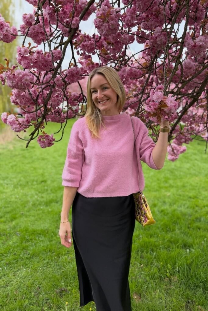 A Black Satin Column Skirt With a Bubblegum Pink Knit