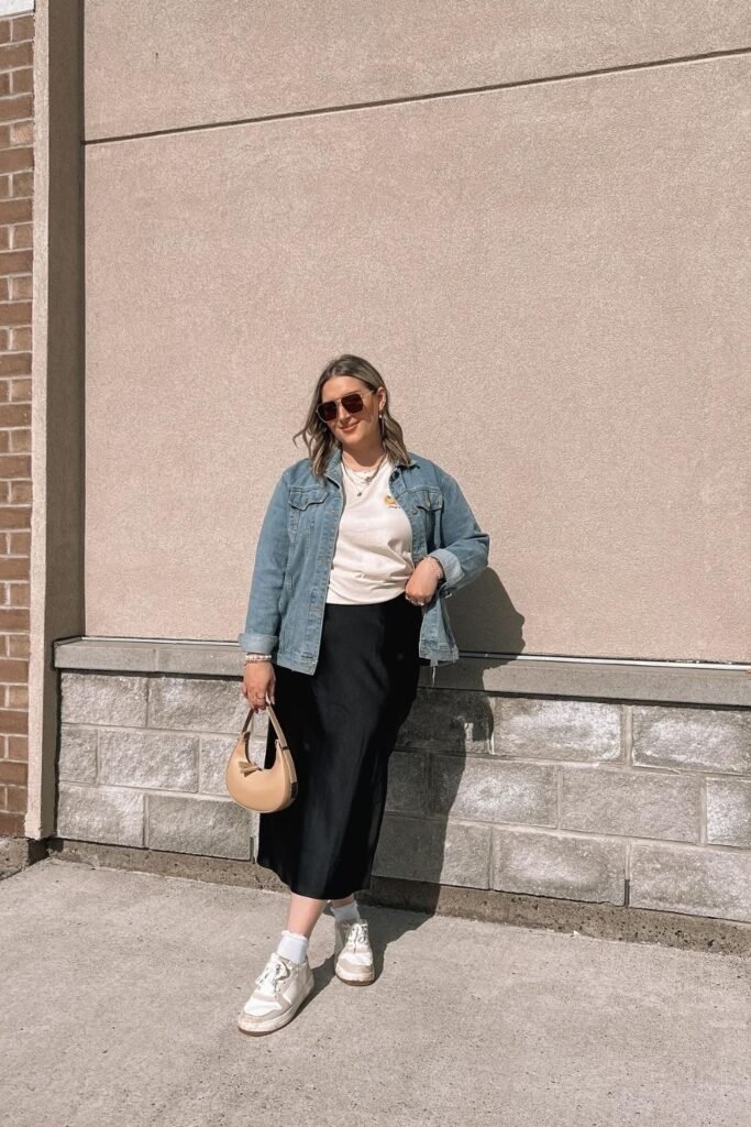 A Black Satin Skirt With a Cream Tee and Light Denim Jacket