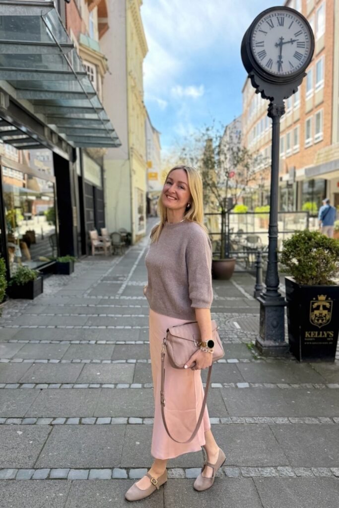 A Blush Satin Skirt With a Taupe Knit and Mary Janes