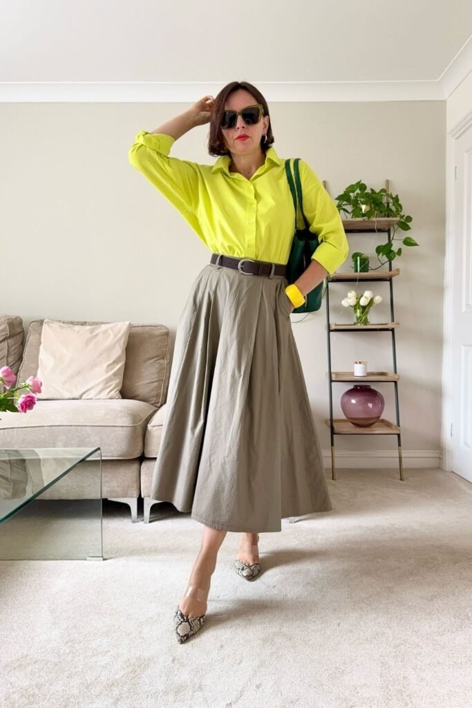 A Chartreuse Shirt Tucked Into an Olive Midi Skirt