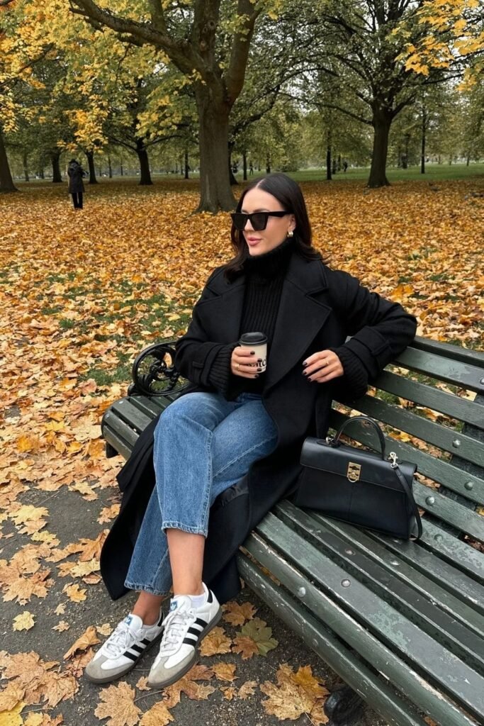 A Long Black Coat Over a Turtleneck and Cropped Jeans