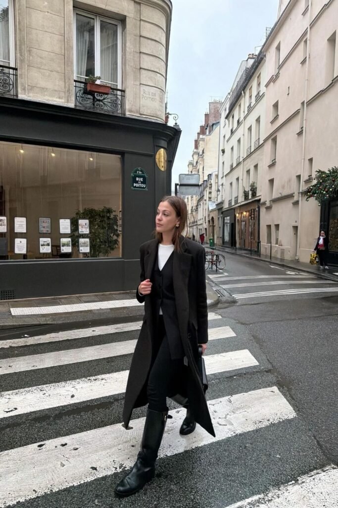 All Black Tailoring Under a Long Coat With Knee High Boots