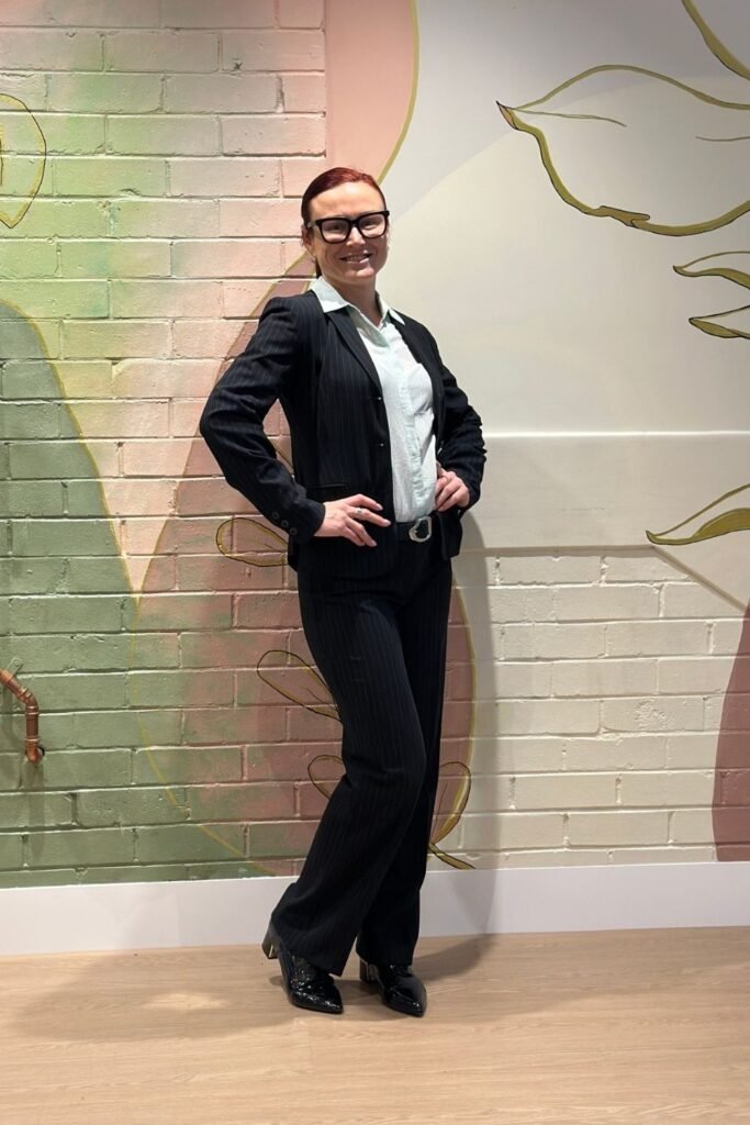 Black Pinstripe Suit With a Pale Blue Shirt