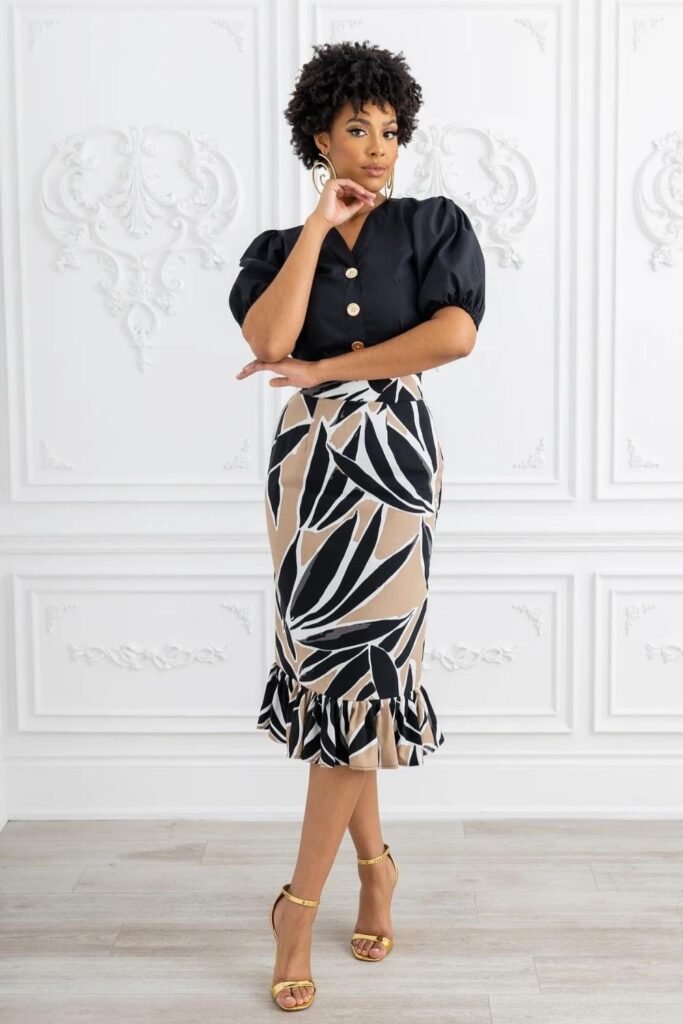 Black Puff Sleeve Blouse With a Printed Peplum Skirt