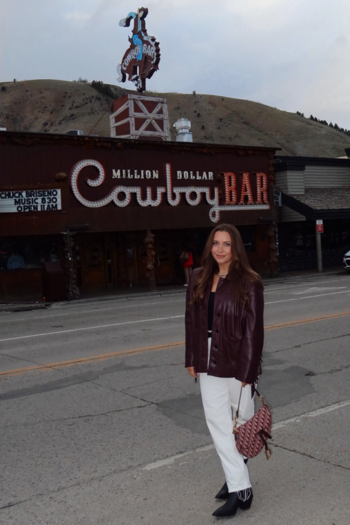 Burgundy Leather Jacket With White Jeans and Black Boots