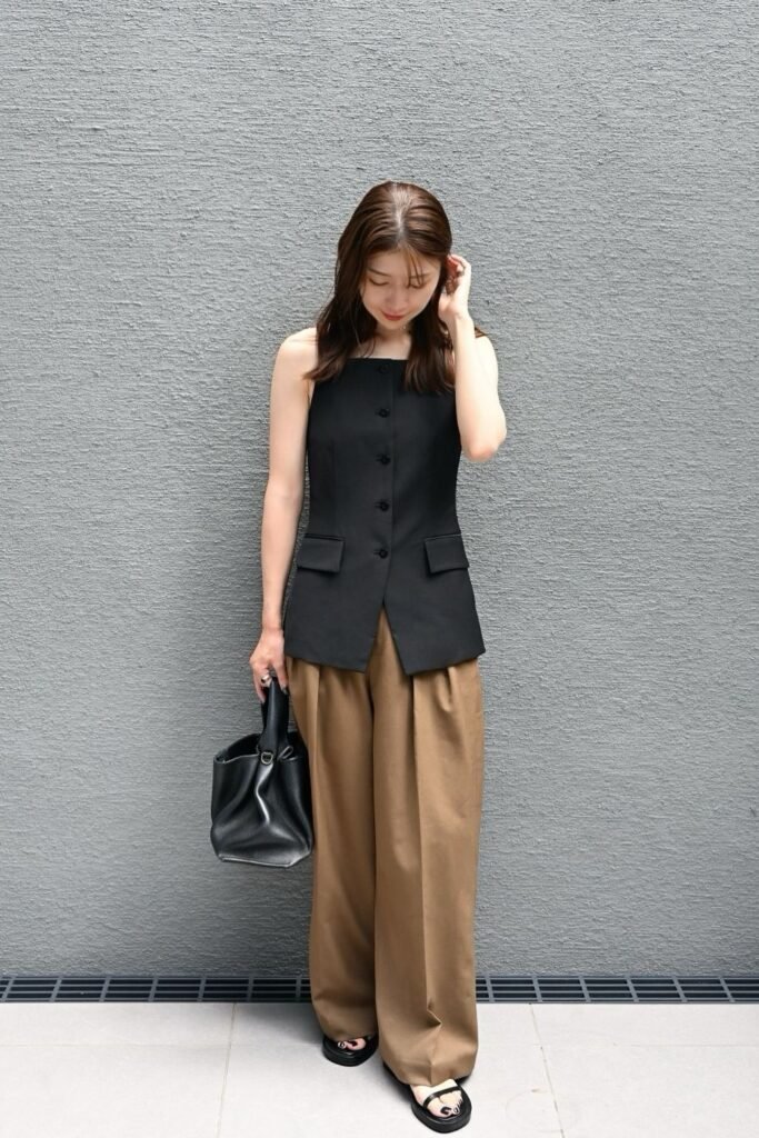 Camel Pleated Trousers With a Black Tailored Waistcoat