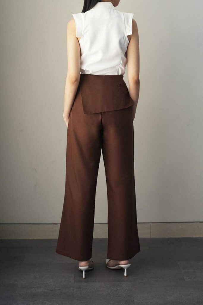 Chestnut Trousers With a Peplum Panel and a White Blouse