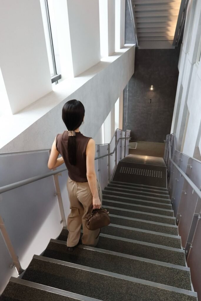 Espresso Sleeveless Shell With Khaki Pleated Trousers