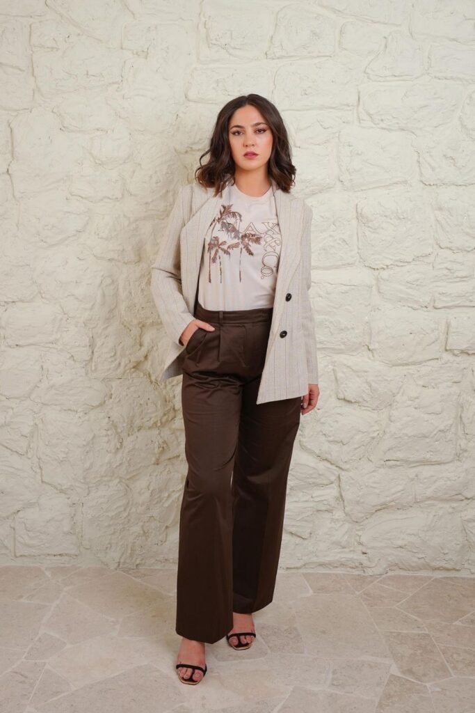 Graphic Tee and a Pinstripe Blazer Over Chocolate Trousers