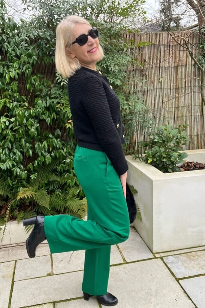 Green Wide Leg Trousers With a Black Knit Cardigan