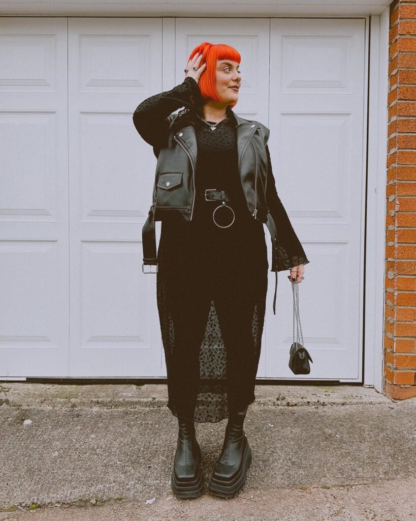 Leather Moto Vest Over a Black Lace Midi Dress_msmancey