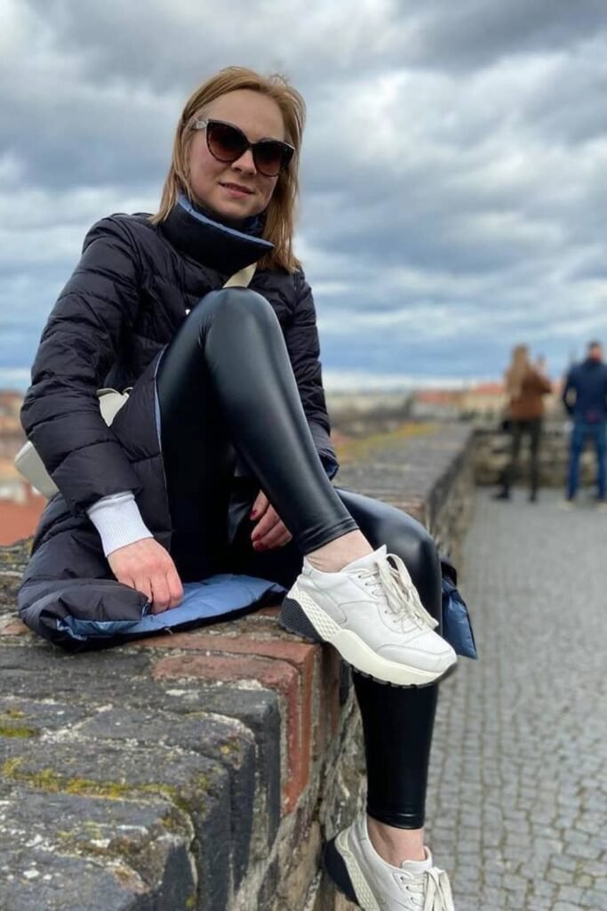 Long Puffer Coat With Glossy Leggings and White Sneakers