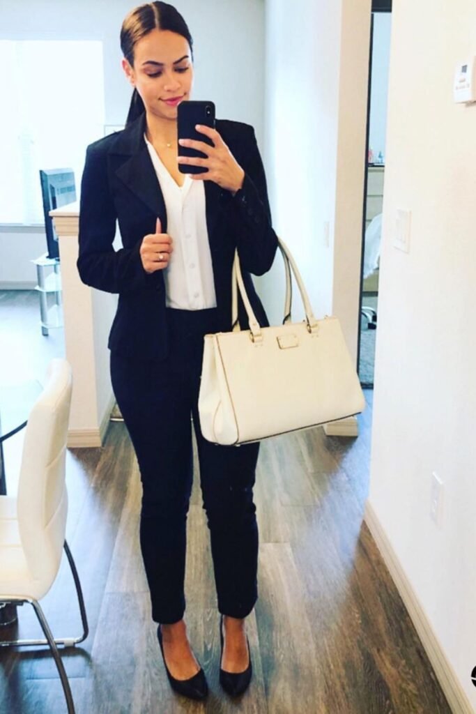 Navy Suit With a White Blouse and a Cream Tote