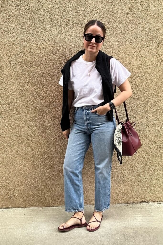 White Tee With a Sweater Over the Shoulders