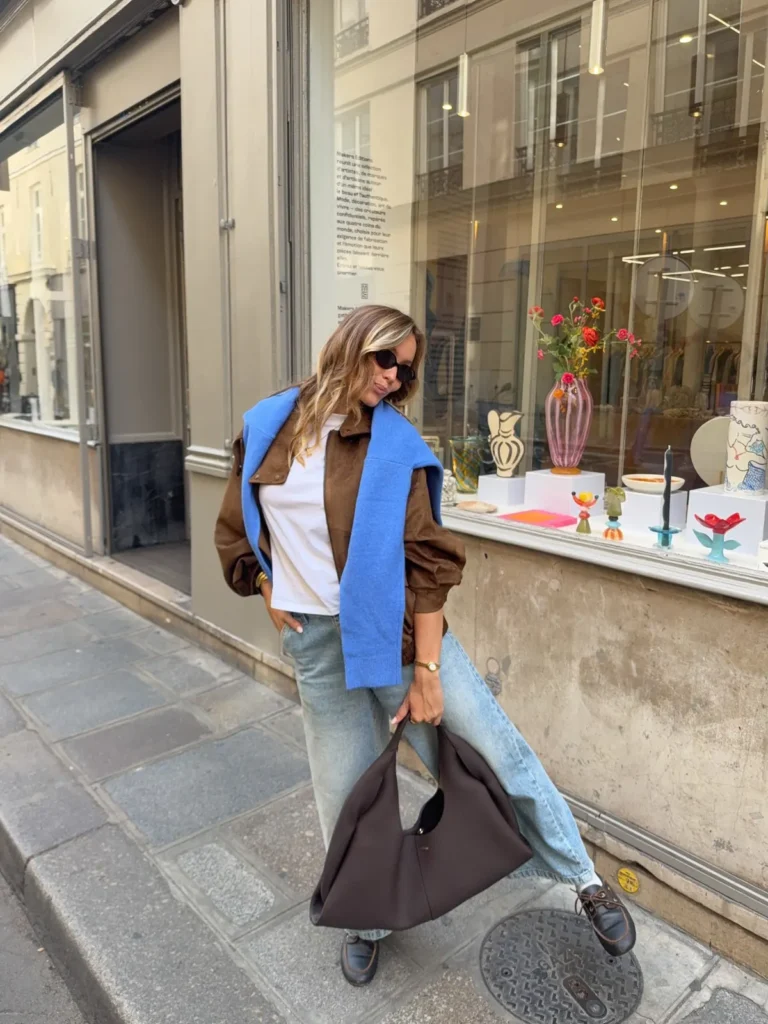 Blue Knit Draped Over a Brown Suede Jacket