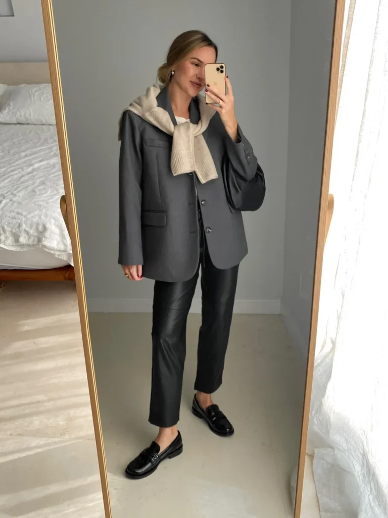 Charcoal Blazer With a Sweater Tied Over the Shoulders