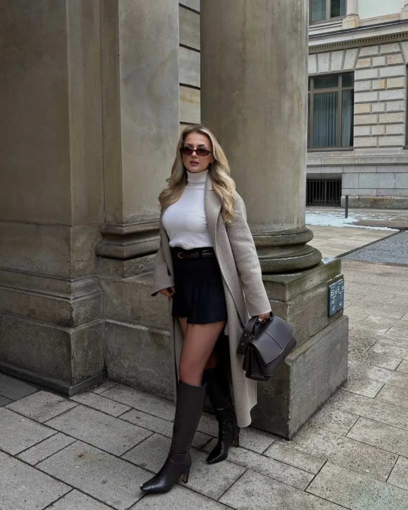  Long Oatmeal Coat Over a Black Pleated Skort