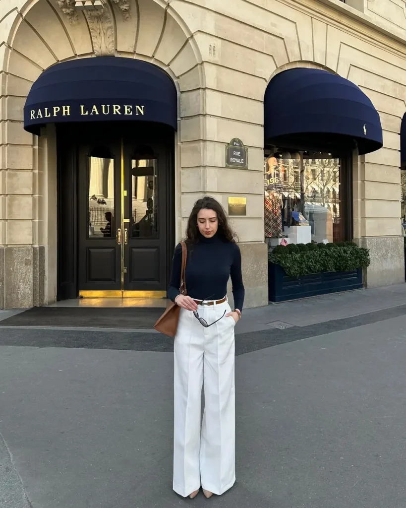 Navy Turtleneck, White Wide-Leg Trousers, and a Tan Bag