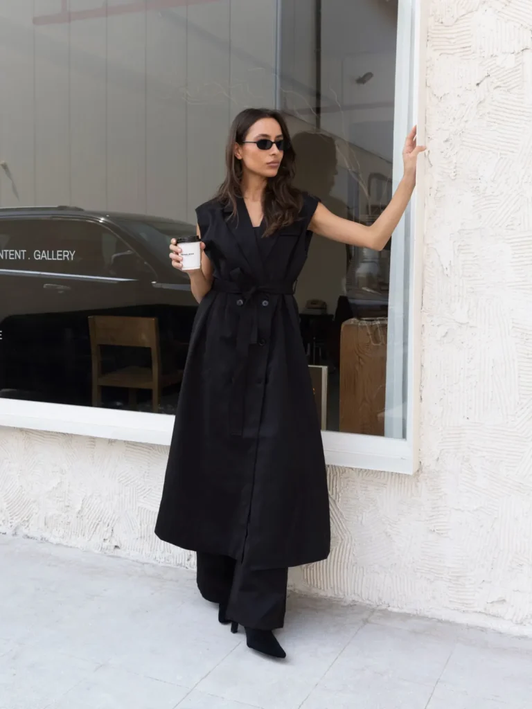 Sleeveless Trench Dress Over Wide-Leg Trousers