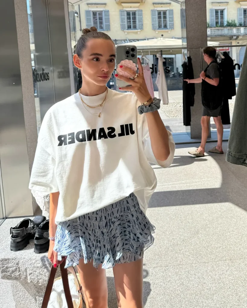Oversized Logo Tee Over a Ruffled Mini Skirt