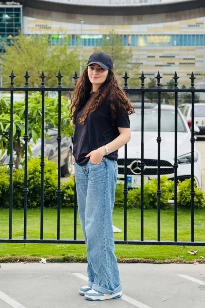 A Plain Black Tee With Cuffed Light Wash Jeans