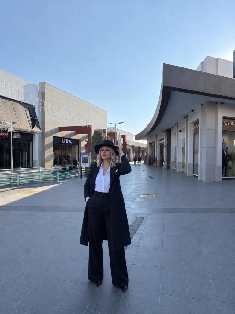 Give a Black Trench Outfit a Tailored Finish With a Wide-Brim Hat