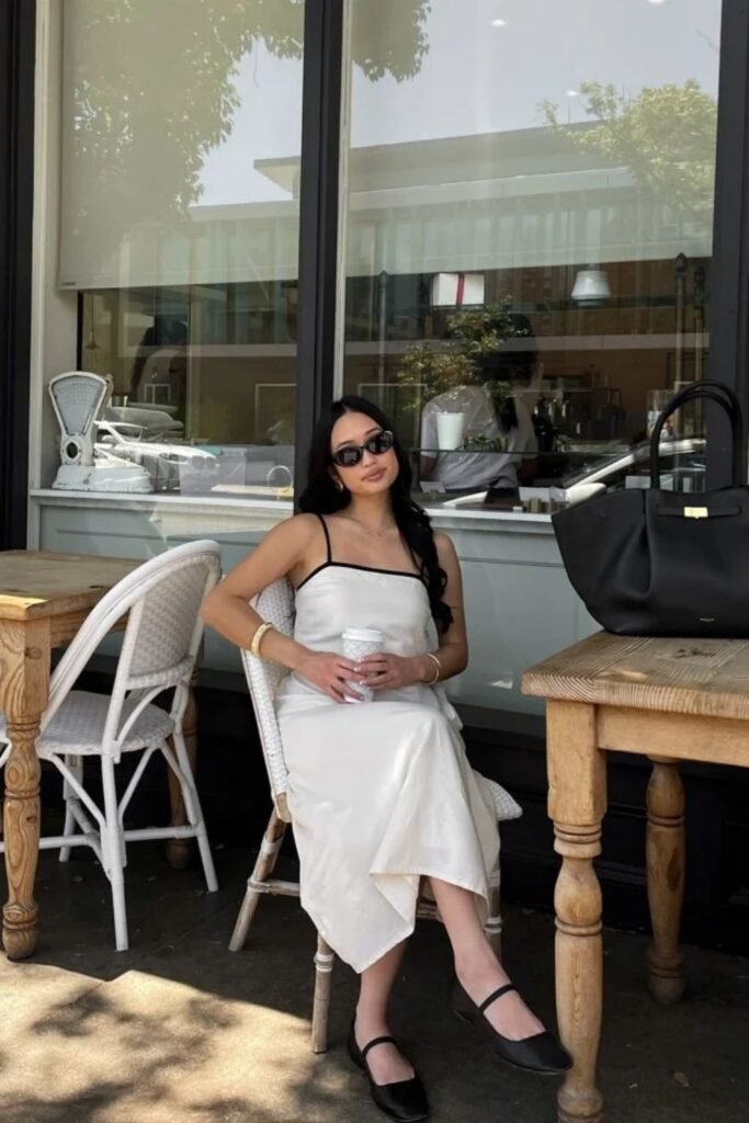 woman wearing Ivory Slip Dress With Black Contrast Straps