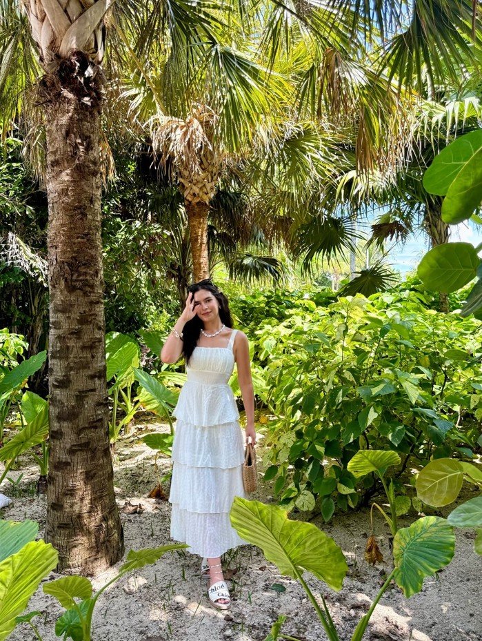 Keep Cool in a White Tiered Maxi Dress and Woven Bag