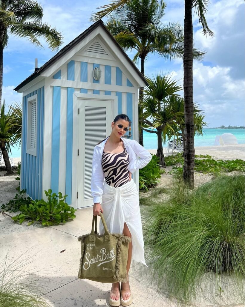 Layer a White Sarong and Shirt Over a Printed Swimsuit