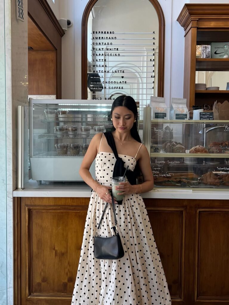 Polka Dot Midi Dress With a Sweater Over the Shoulder